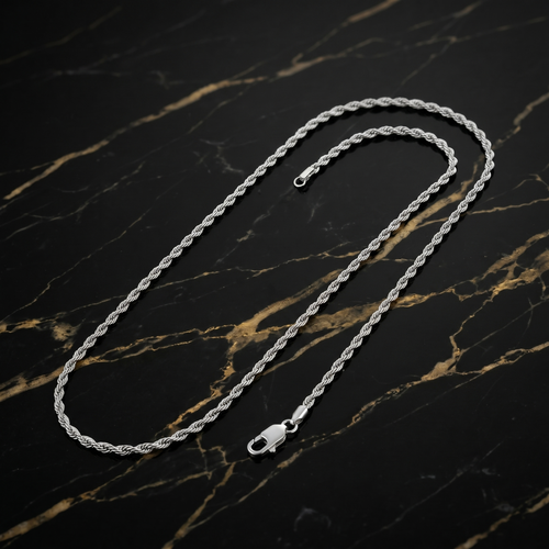 1MM Solid 925 Sterling Silver Italian Diamond Cut Rope Chain Necklace on a black marble surface