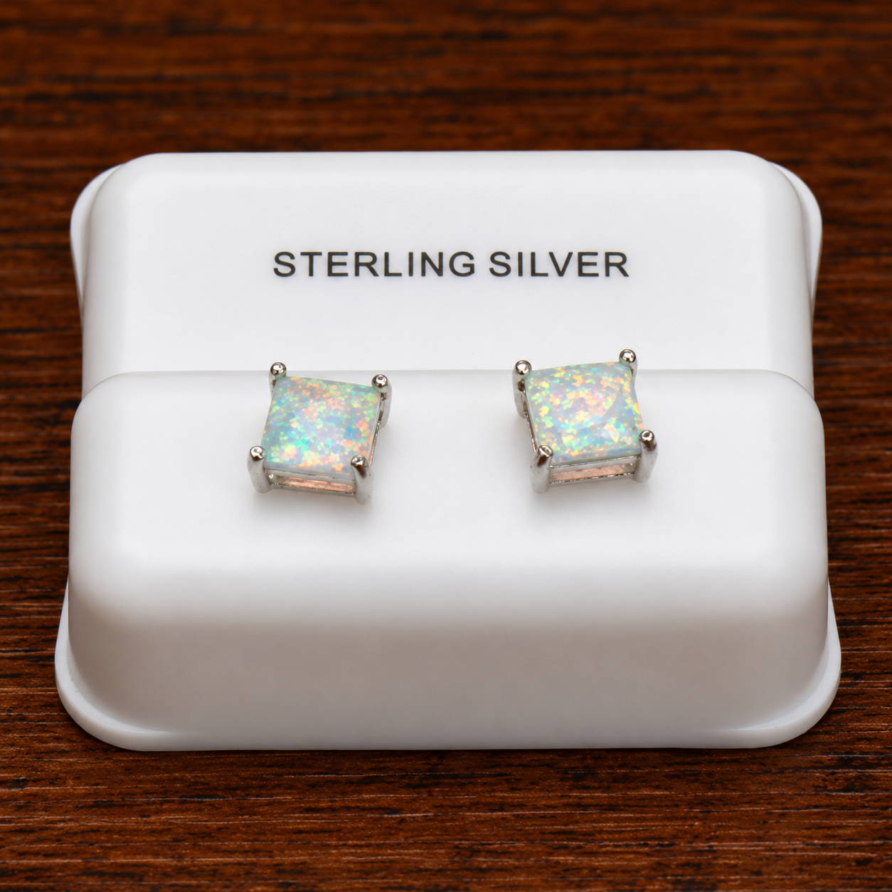 White opal square earrings in 925 sterling silver on a white display stand