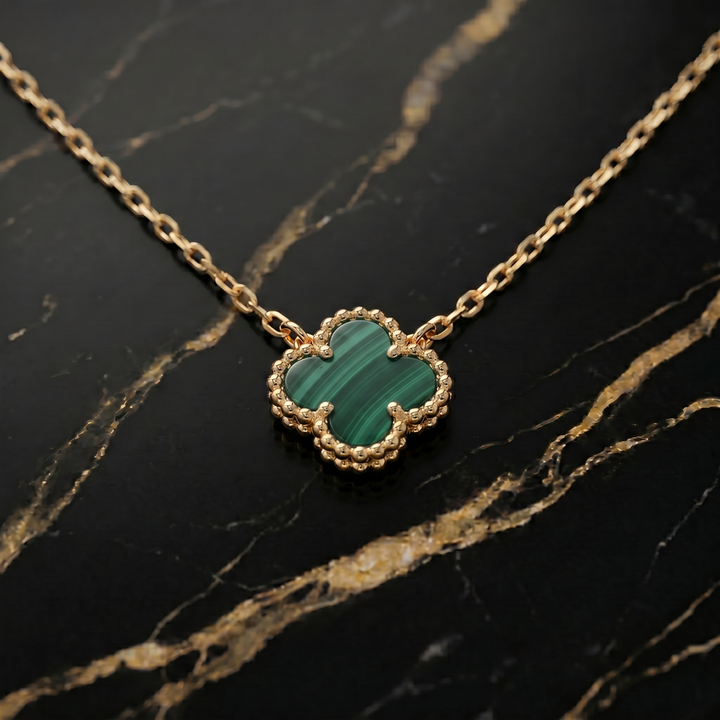 Natural Green Malachite Clover 18” Adjustable Necklace 14k Gold/925 Silver on a black marble surface