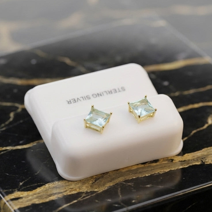 Blue Topaz Cz Earrings Square 14k Gold over 925 Sterling Silver on a white display