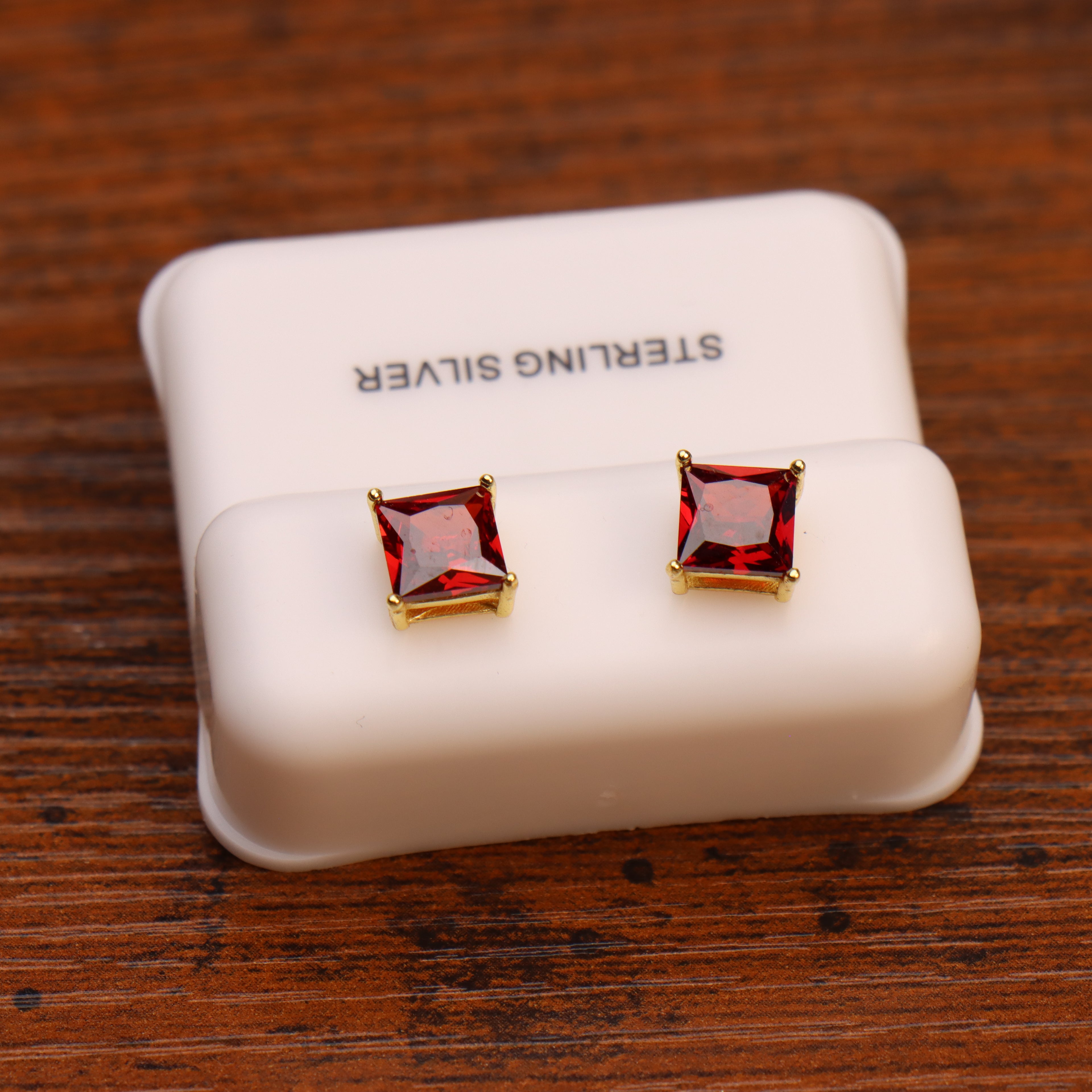 Ruby Red Cz Earrings Square 14k Gold over 925 Sterling Silver on a white stand