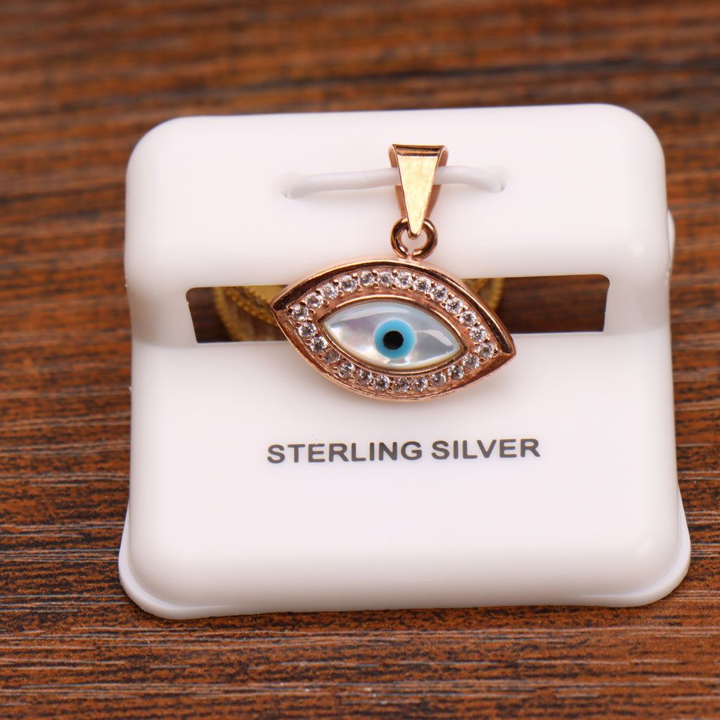 Evil eye pendant in rose gold sterling silver with CZ halo and mother of pearl inlay on a white display stand
