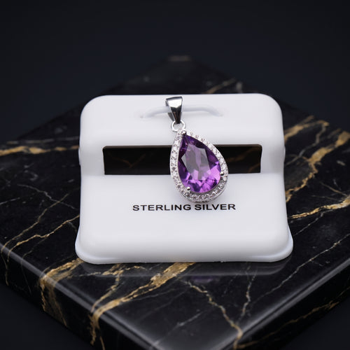 Amethyst pear shaped pendant with a cubic zirconia halo set in 925 sterling silver