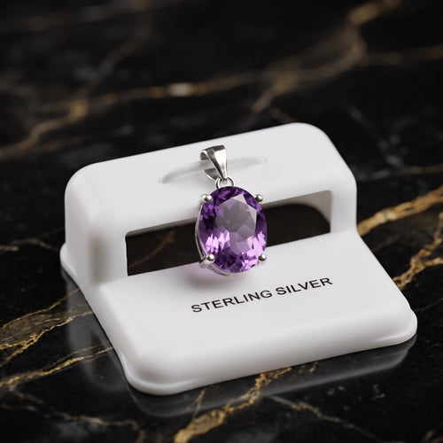 Amethyst oval semi precious natural pendant in 925 sterling silver on a white display stand
